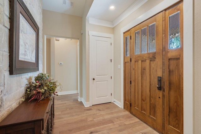 3602 Red Cedar Ct, Bryan, TX 77807 - entrance foyer featuring light wood-style floors, ornamental molding, and baseboards