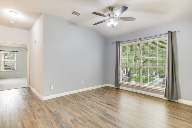 2709 Melba Pass, Cedar Park, TX 78613 - spare room featuring wood finished floors, a ceiling fan, baseboards, and lofted ceiling