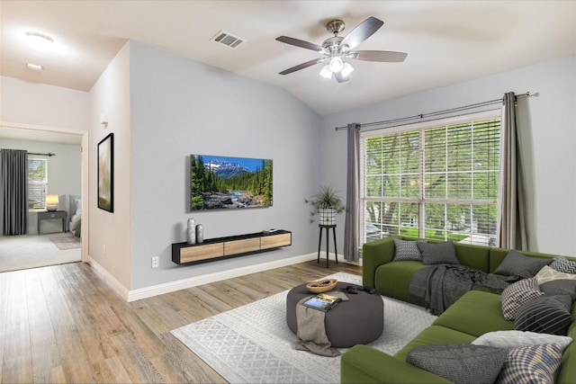 2709 Melba Pass, Cedar Park, TX 78613 - living room featuring wood finished floors, ceiling fan, baseboards, and vaulted ceiling