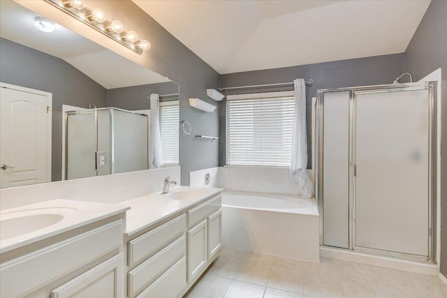 2709 Melba Pass, Cedar Park, TX 78613 - bathroom with a stall shower, double vanity, a bath, tile patterned flooring, and lofted ceiling