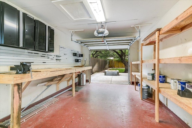 2709 Melba Pass, Cedar Park, TX 78613 - garage featuring a garage door opener and a workshop area