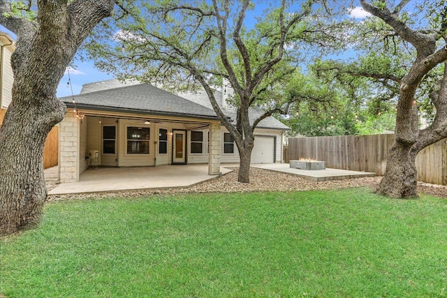 2709 Melba Pass, Cedar Park, TX 78613 - back of house featuring a garage, a fenced backyard, a patio, and roof with shingles