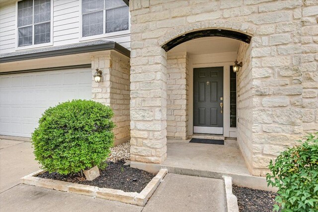 2709 Melba Pass, Cedar Park, TX 78613 - property entrance with stone siding and an attached garage
