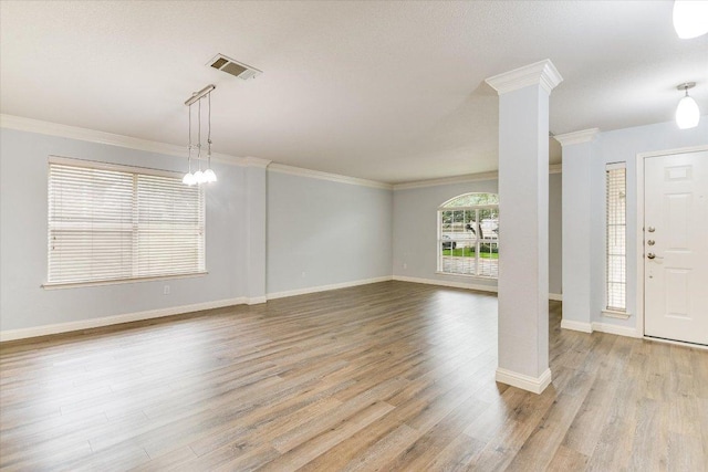 2709 Melba Pass, Cedar Park, TX 78613 - foyer entrance with wood finished floors, crown molding, and ornate columns