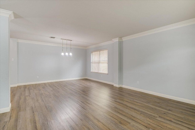 2709 Melba Pass, Cedar Park, TX 78613 - empty room with ornamental molding, wood finished floors, baseboards, and a chandelier