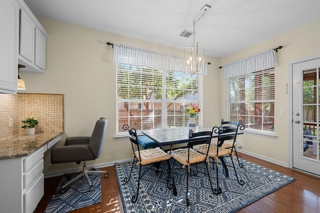 5302 Austral Loop, Austin, TX 78739 - dining space with dark wood-style flooring, a chandelier, and track lighting