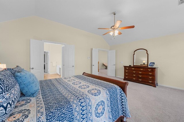 5302 Austral Loop, Austin, TX 78739 - bedroom with lofted ceiling, light carpet, ceiling fan, baseboards, and connected bathroom