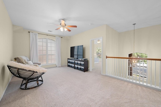 5302 Austral Loop, Austin, TX 78739 - living area with ceiling fan, carpet, and a chandelier