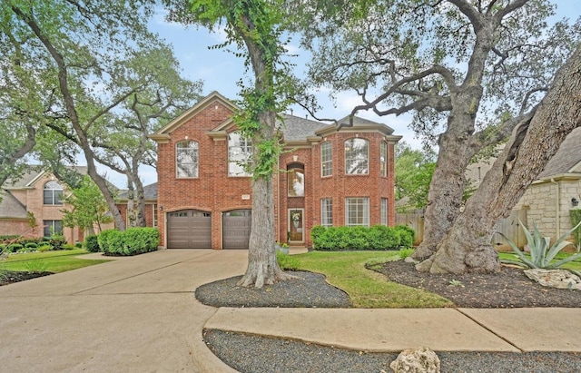 5302 Austral Loop, Austin, TX 78739 - view of front of property featuring concrete driveway, brick siding, and an attached garage