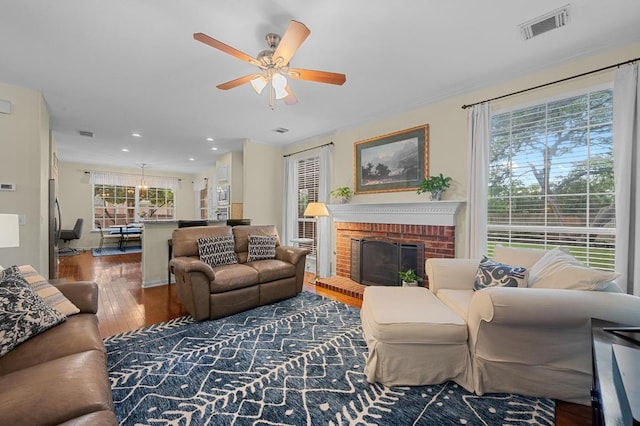 5302 Austral Loop, Austin, TX 78739 - living area featuring hardwood / wood-style floors, a ceiling fan, recessed lighting, and a fireplace