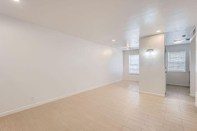 300 Crockett St Unit 115, Austin, TX 78704 - empty room featuring baseboards, recessed lighting, light wood-type flooring, and ceiling fan