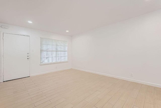 300 Crockett St Unit 115, Austin, TX 78704 - empty room featuring baseboards, light wood-style floors, and recessed lighting