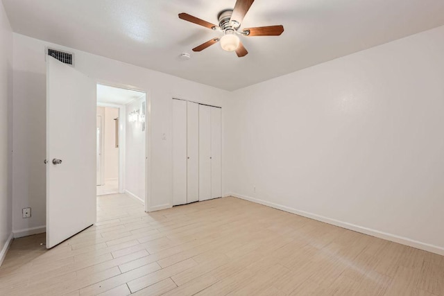 300 Crockett St Unit 115, Austin, TX 78704 - unfurnished bedroom featuring light wood-style floors, baseboards, a closet, and ceiling fan