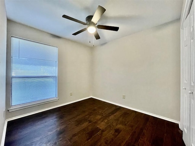 1933 Lisa Ln, San Marcos, TX 78666 - unfurnished room featuring dark wood finished floors, ceiling fan, and baseboards