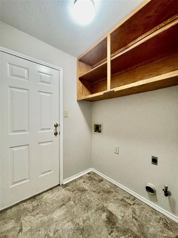 1933 Lisa Ln, San Marcos, TX 78666 - laundry area with hookup for a gas dryer, electric dryer hookup, baseboards, and hookup for a washing machine