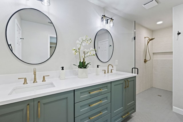 3701 Arrowhead Cir, Round Rock, TX 78681 - bathroom featuring a tile shower, double vanity, and recessed lighting