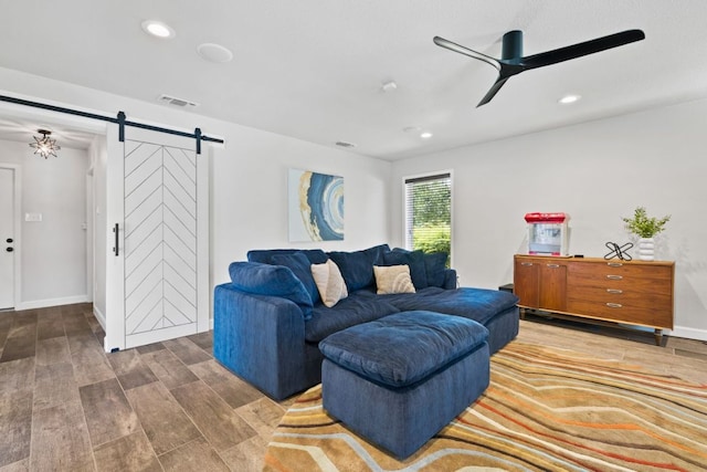 3701 Arrowhead Cir, Round Rock, TX 78681 - living room with a barn door, a ceiling fan, wood finished floors, and recessed lighting