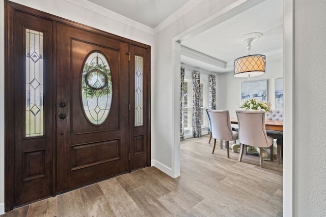 3701 Arrowhead Cir, Round Rock, TX 78681 - foyer with light wood-style flooring and crown molding