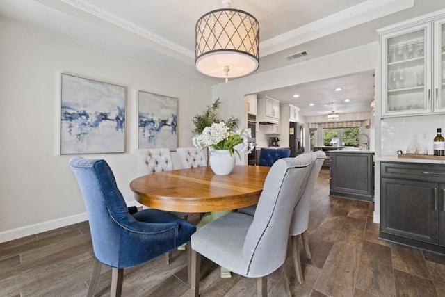 3701 Arrowhead Cir, Round Rock, TX 78681 - dining room with a raised ceiling, recessed lighting, and dark wood-type flooring