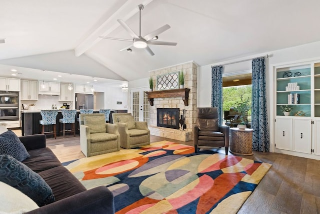 3701 Arrowhead Cir, Round Rock, TX 78681 - living room featuring light wood-type flooring, a stone fireplace, ceiling fan, and recessed lighting