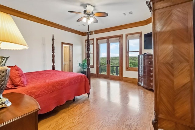402 Lander Ln, Dripping Springs, TX 78620 - bedroom with access to exterior, wood finished floors, baseboards, crown molding, and french doors