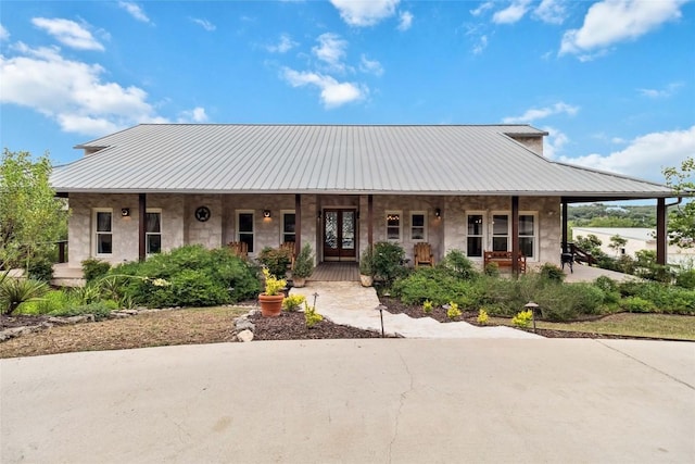 402 Lander Ln, Dripping Springs, TX 78620 - view of front facade featuring a porch and metal roof