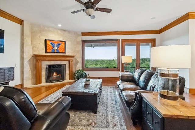 402 Lander Ln, Dripping Springs, TX 78620 - living area featuring wood finished floors, a ceiling fan, and a high end fireplace