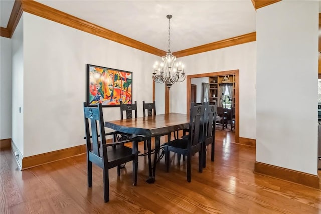 402 Lander Ln, Dripping Springs, TX 78620 - dining area with ornamental molding, wood finished floors, baseboards, and a chandelier