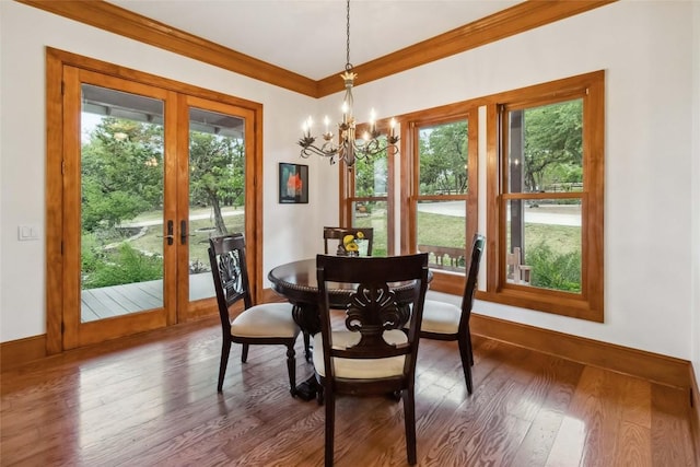 402 Lander Ln, Dripping Springs, TX 78620 - dining space featuring healthy amount of natural light, a chandelier, crown molding, and baseboards