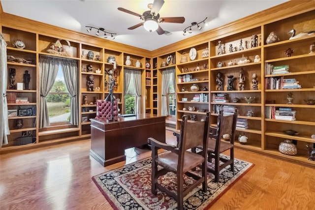 402 Lander Ln, Dripping Springs, TX 78620 - office space with rail lighting, a ceiling fan, and wood finished floors