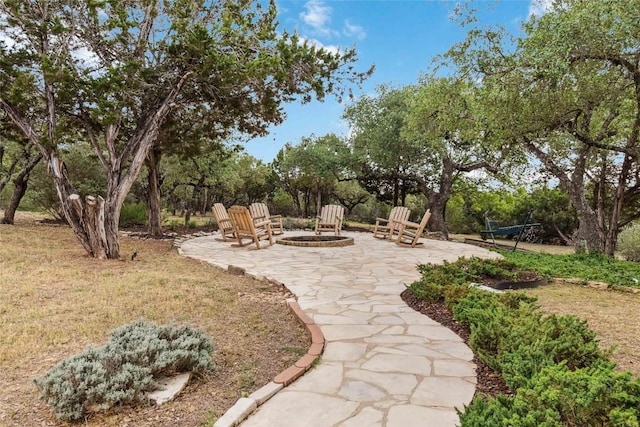 402 Lander Ln, Dripping Springs, TX 78620 - view of patio / terrace featuring a fire pit and view of scattered trees