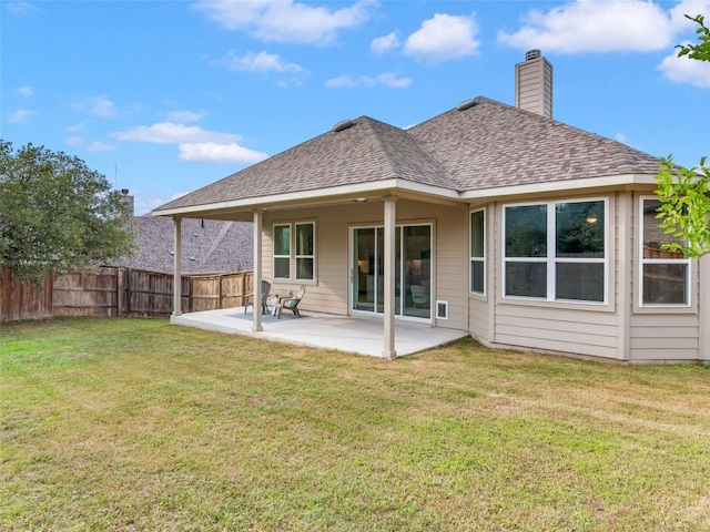 8505 Moccasin Path, Austin, TX 78736 - back of house featuring a patio area, a shingled roof, and a chimney