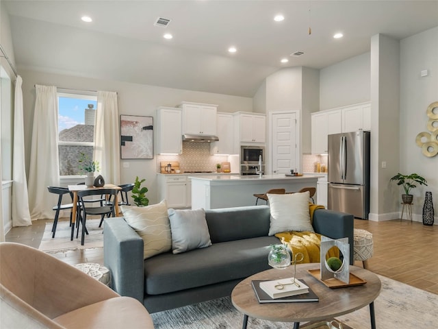 8505 Moccasin Path, Austin, TX 78736 - living room featuring light wood finished floors, recessed lighting, baseboards, and lofted ceiling