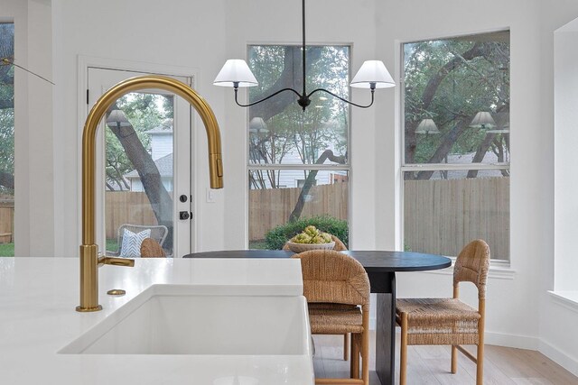 5209 Concho Creek Bnd, Austin, TX 78735 - dining room with wood finished floors and a chandelier