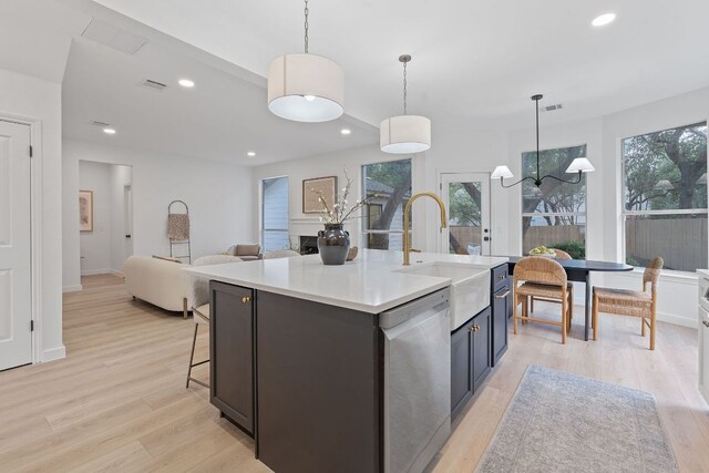 5209 Concho Creek Bnd, Austin, TX 78735 - kitchen featuring dishwasher, light wood-style flooring, healthy amount of natural light, light countertops, and recessed lighting