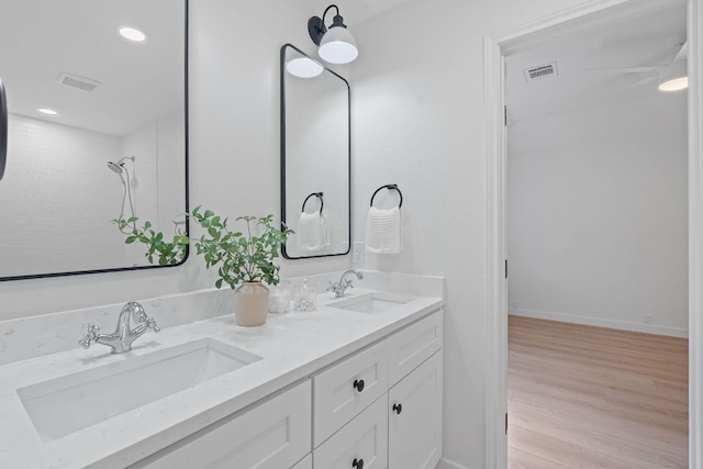 5209 Concho Creek Bnd, Austin, TX 78735 - full bath featuring double vanity, wood finished floors, recessed lighting, and baseboards