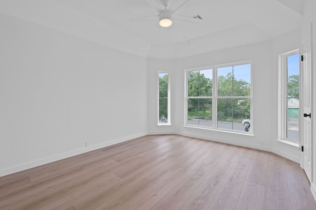 5209 Concho Creek Bnd, Austin, TX 78735 - unfurnished room with light wood-style flooring, a ceiling fan, baseboards, and a raised ceiling