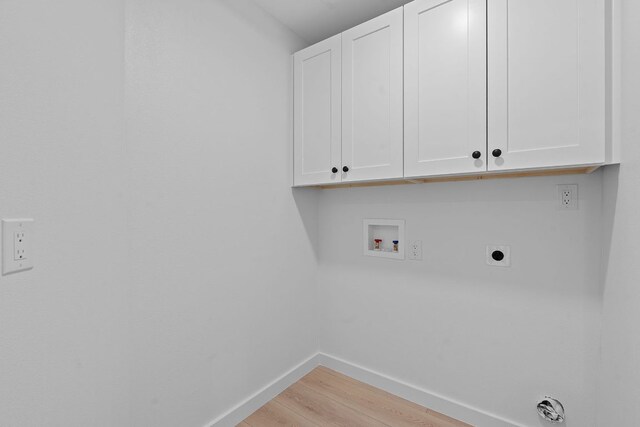 5209 Concho Creek Bnd, Austin, TX 78735 - laundry room featuring cabinet space, light wood-style flooring, hookup for a washing machine, and hookup for an electric dryer