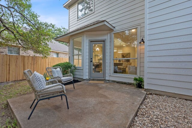 5209 Concho Creek Bnd, Austin, TX 78735 - view of exterior entry featuring a patio