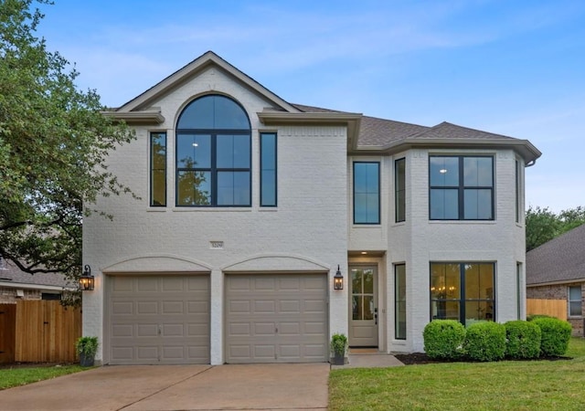 5209 Concho Creek Bnd, Austin, TX 78735 - view of front of property with concrete driveway, a garage, and brick siding