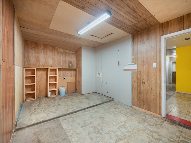 1021 Gardner Rd, Austin, TX 78721 - spare room with wooden walls, attic access, wood ceiling, and vaulted ceiling