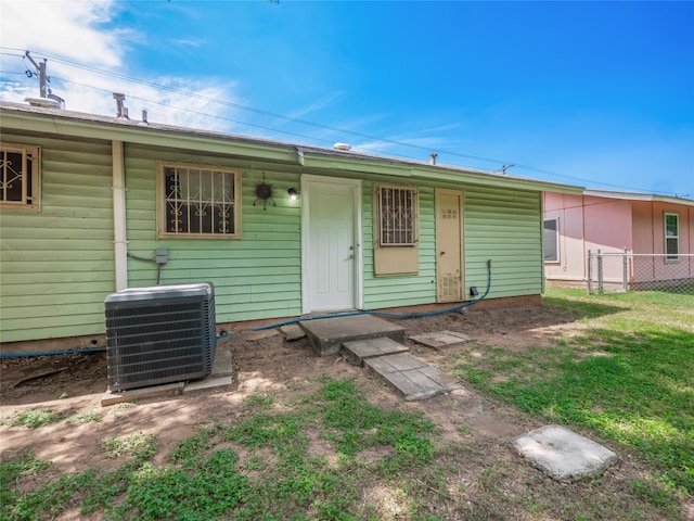 1021 Gardner Rd, Austin, TX 78721 - rear view of property featuring central AC unit