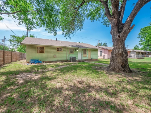 1021 Gardner Rd, Austin, TX 78721 - rear view of house featuring central AC unit