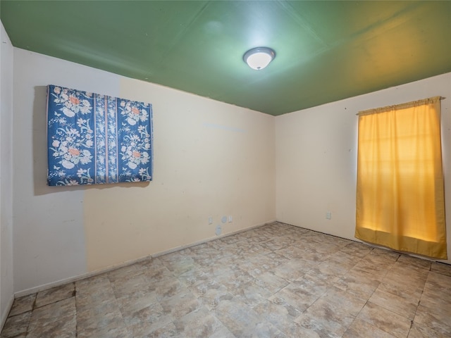 1021 Gardner Rd, Austin, TX 78721 - spare room with stone finish floors