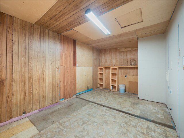 1021 Gardner Rd, Austin, TX 78721 - spare room with wooden walls, wood ceiling, and attic access