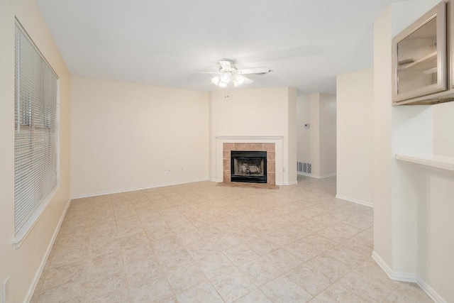 2202 Clayton Way, Cedar Park, TX 78613 - unfurnished living room featuring a ceiling fan, a fireplace, and baseboards