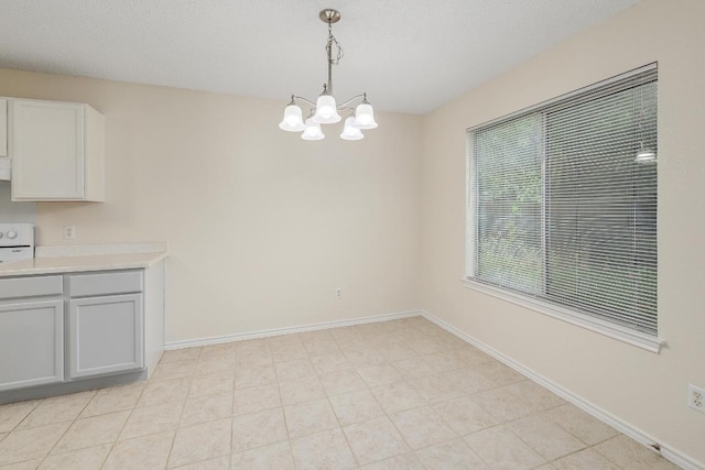 2202 Clayton Way, Cedar Park, TX 78613 - unfurnished dining area with a chandelier and baseboards