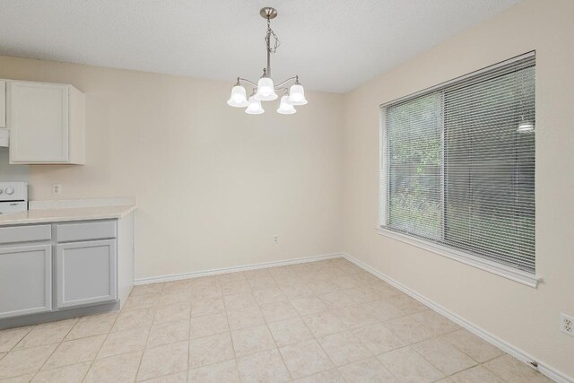 2202 Clayton Way, Cedar Park, TX 78613 - unfurnished dining area featuring a chandelier and baseboards