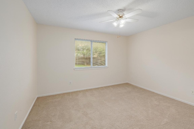 2202 Clayton Way, Cedar Park, TX 78613 - unfurnished room with light colored carpet, a textured ceiling, ceiling fan, and baseboards