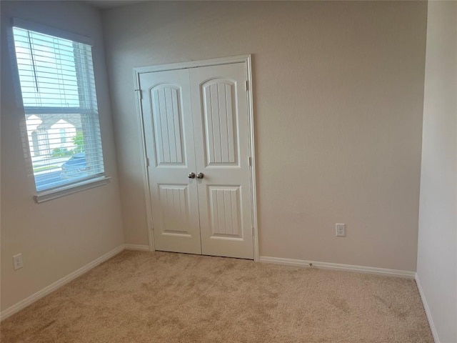 201 Abby Rd, Georgetown, TX 78626 - unfurnished bedroom with carpet flooring, a closet, and baseboards